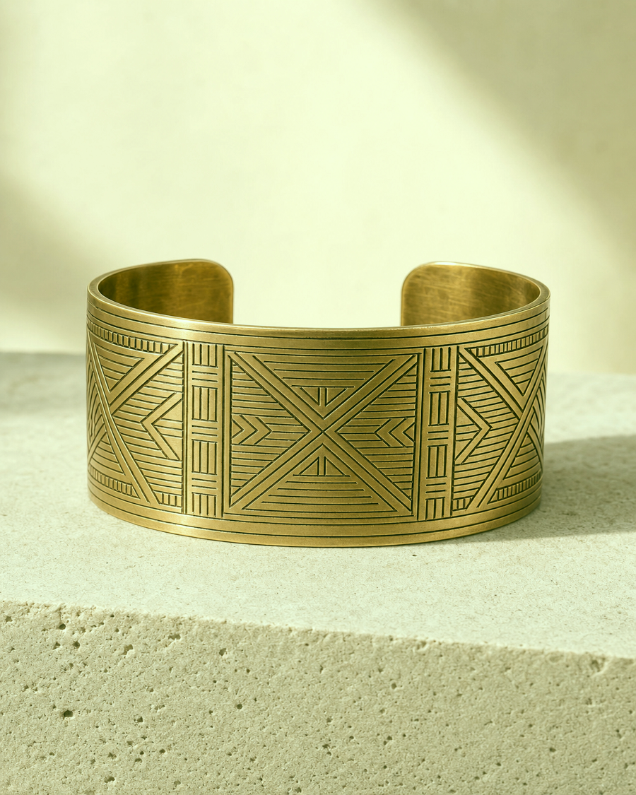 Detail editorial view of the Adinkra Brass Cuff