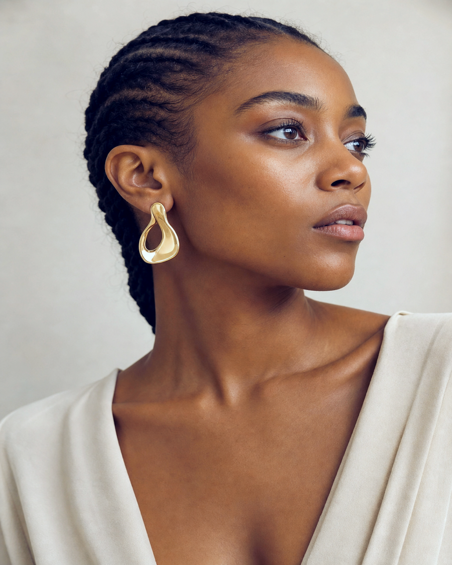 Editorial movement view of the Ayana Sculptural Gold Earrings