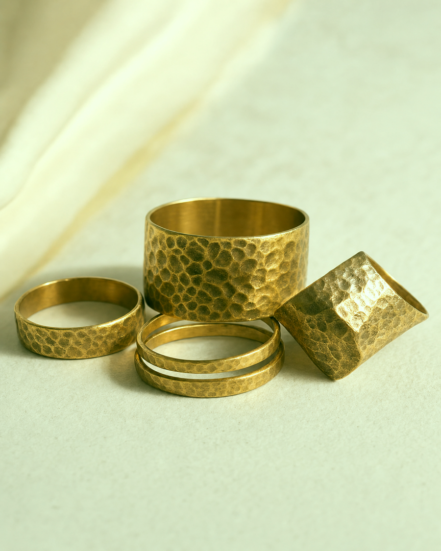 Detail editorial view of the Oru Hammered Brass Ring Set